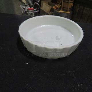 Acopa 5 Inch Souffle Dish, white ceramic, gently used, slight edge wear. Model: 12XBID. Ideal for baking and serving.
