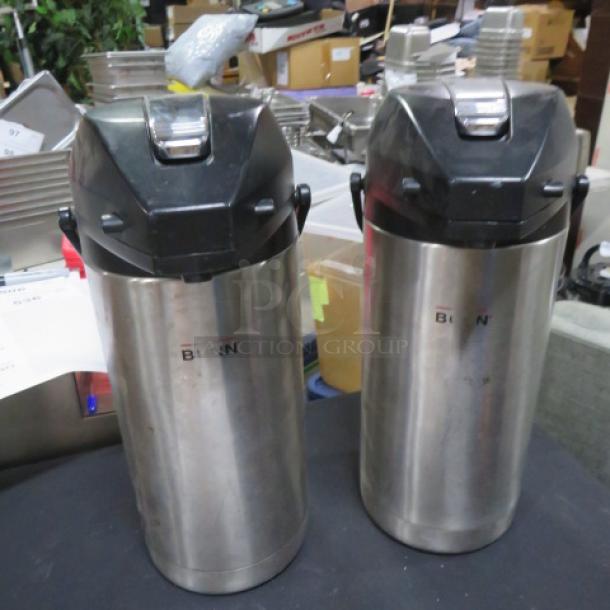 Bunn AirPot 2XBID duo, stainless steel with black lids, used condition, suitable for keeping beverages hot or cold.