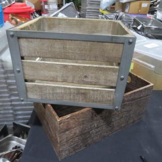 Assorted wooden boxes, rustic finish, one with metal frame accents, stacked, good condition, ideal for storage or décor.