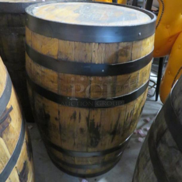 Jack Daniels whiskey barrel, wooden with metal bands, used condition; brand markings on top indicate authenticity.