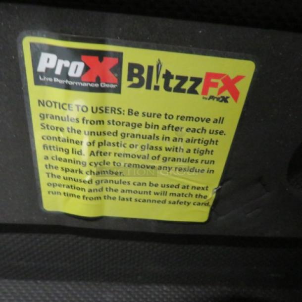 ProX Blitzz FX Dual Cold Spark Machines with aluminum covers, in flight case on casters. Non-pyrotechnic, 10ft sparkler effect, ideal for events. Visible label advises on granule storage and cleaning.