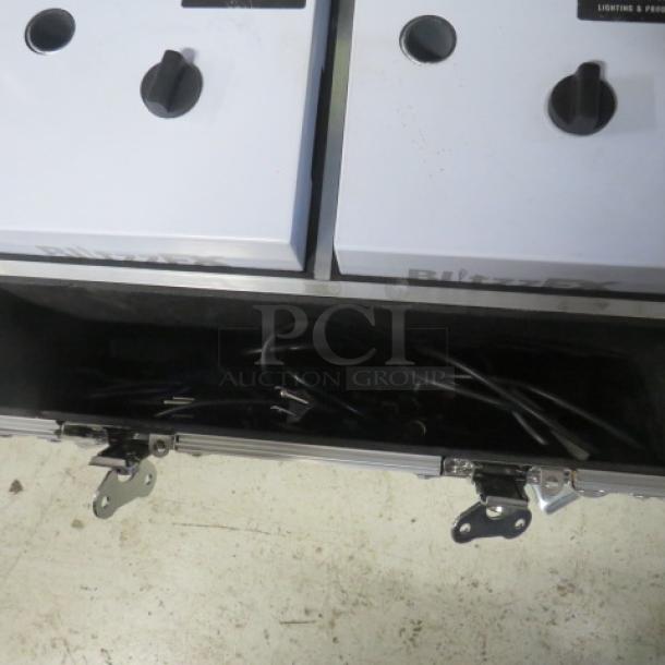 One PRO-X BLITZZ FX dual cold spark machines with aluminum covers in a flight case on casters; ideal for events.