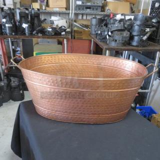 Copper hammered metal beverage/ice holder with handles, oval shape, excellent condition.