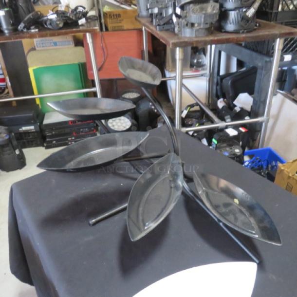 Black metal 5-tier buffet display server with five melamine canoe-shaped food holders, excellent condition.