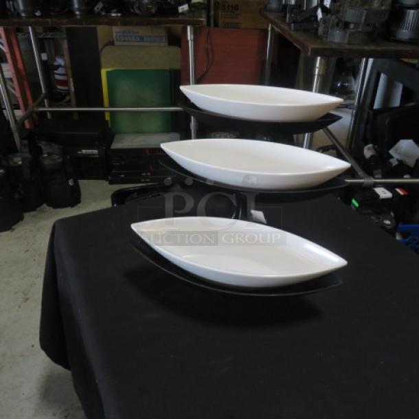 Black metal 3-tier buffet display server with three white melamine canoe-shaped food holders. Perfect condition.