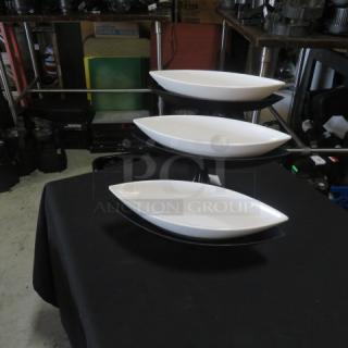 Black metal 3-tier buffet display server with three white melamine canoe-shaped food holders. Perfect condition.