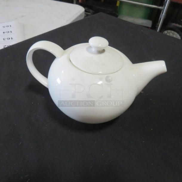 Fortessa Bone China Tea Pot with lid, glossy white finish, classic design, excellent condition, labeled "Fortessa 3XBID."