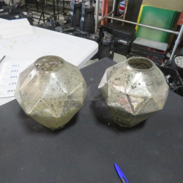 Silver crackle candle holders, geometric design, set of two, visible wear, reflective finish, decorative use.