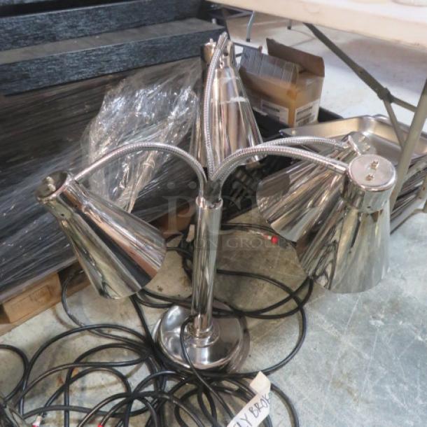 Stainless steel buffet 4 bulb food warmer with adjustable arms in excellent condition; includes power cords.