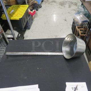 Stainless steel soup ladle, model 3XBID, with long handle and perforated bowl, in used condition.