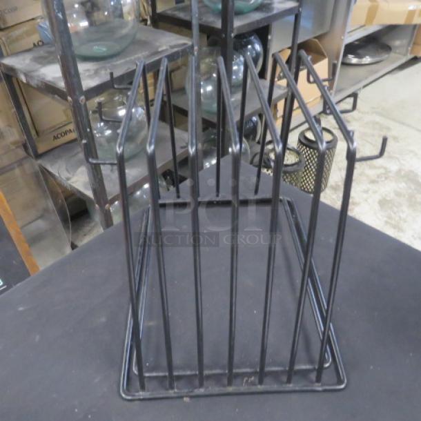 Black metal pan/lid holder, 12x9x10 inches, features vertical slots for organizing cookware. Excellent condition.