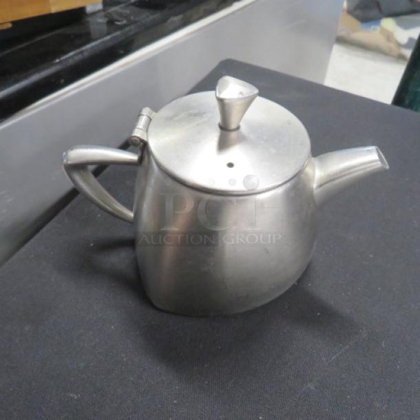 Vollrath 12oz stainless steel creamer, model 46307, with handle and spout. Slightly used condition.