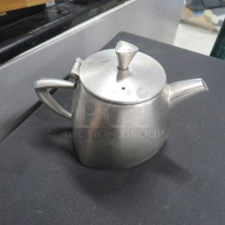 Vollrath 12oz stainless steel creamer, model 46307, with handle and spout. Slightly used condition.