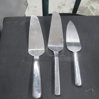Assorted pie servers, stainless steel, set of three, slightly used condition. Different blade shapes for versatile serving.