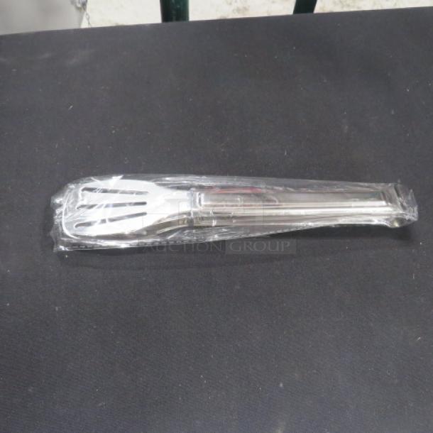 New 9-inch stainless steel serving tong in packaging, model 6XBID, on a black surface.