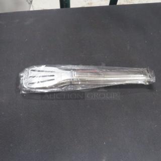 New 9-inch stainless steel serving tong in packaging, model 6XBID, on a black surface.