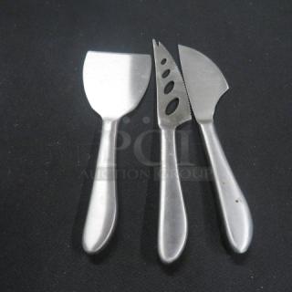 Set of 3 stainless steel cheese utensils, includes spreader, slicer, and knife; sleek design, good condition.