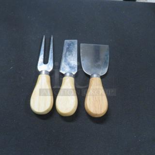 Set of 3 cheese utensils with wooden handles; includes a fork, cleaver, and spatula-type knife. Excellent condition.