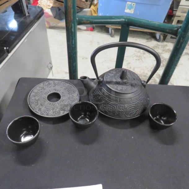 New Kendal iron pot tea set with intricate design, includes teapot, lid, and three cups, in excellent condition.