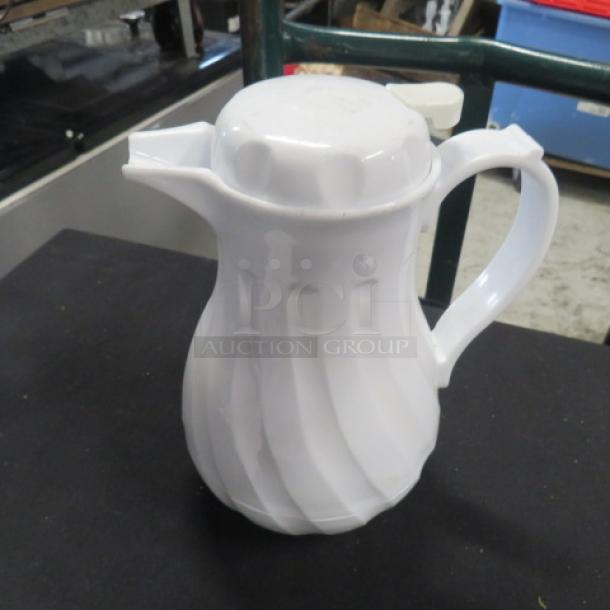 White Swirl Beverage Dispenser, model 2XBID. Features a lidded spout and ergonomic handle. Excellent condition, glossy finish.