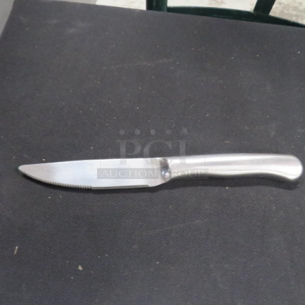 NICE Stainless Steel DON steak knife with serrated edge and smooth handle, excellent condition, model 12XBID.