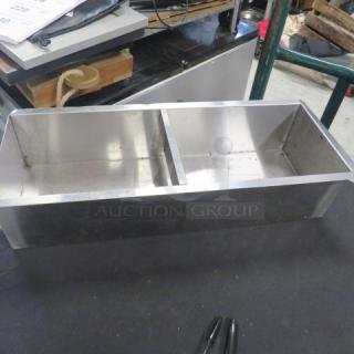 Stainless steel holder, 20.5x8x5 inches, double compartment, used condition with visible wear. Ideal for organization.