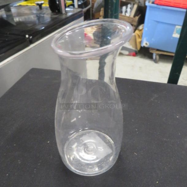 Clear glass Poly Salsa Jar, model 12XBID, in good condition, featuring a wide rim and curvy shape.