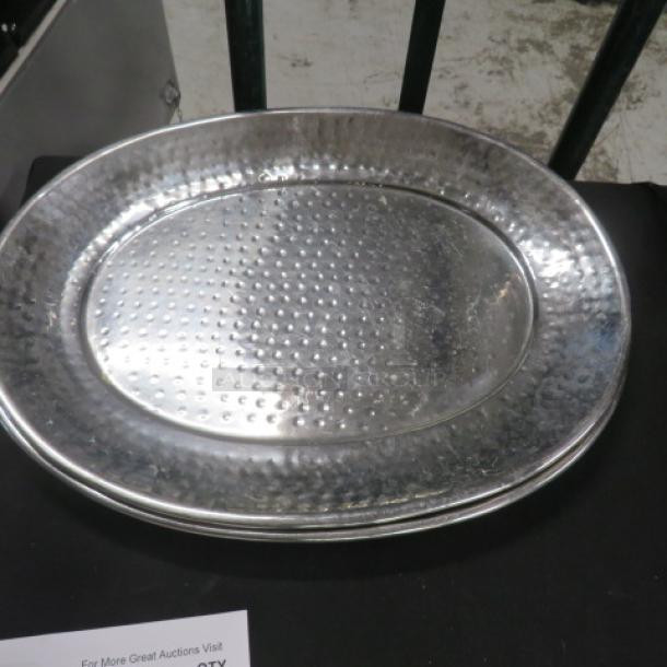 Stainless steel hammered platter, 17.5x13.5 inches, oval shape, polished finish, excellent condition.