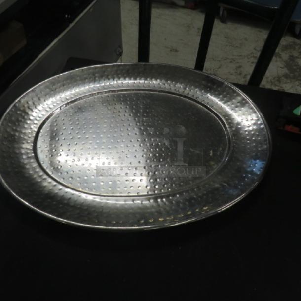 20.5x16 inch stainless steel hammered platter, gently used, showcasing a textured surface.