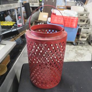 Red metal candle holder, 8x12 inches, lattice design with handle. Good condition, ideal for decorative use.