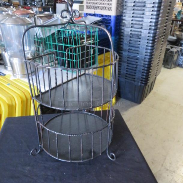 Metal 2-tier holder, 12x25 inches. Features wireframe design, sturdy base, and elegant scroll details. Ideal for display.