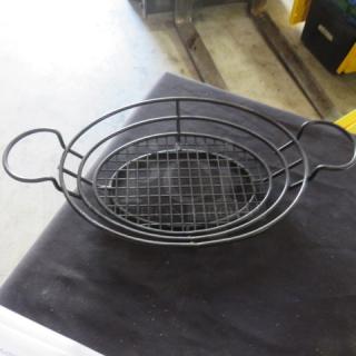 Black metal fast food basket, 11x9 inches, with handles. Features a grid pattern base. Appears in good condition.