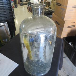 Silver glass vase, cylindrical shape, reflective finish, vintage condition. Appears slightly weathered, no visible markings.