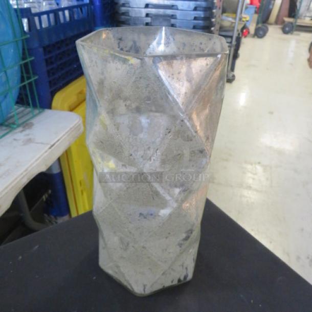 Silver glass vase with geometric facets, weathered finish. 2XBID model, showing signs of use. Stylish decor piece.