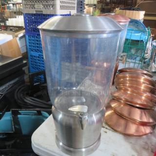 Stainless steel beverage dispenser with clear container and silver spigot, in excellent condition.