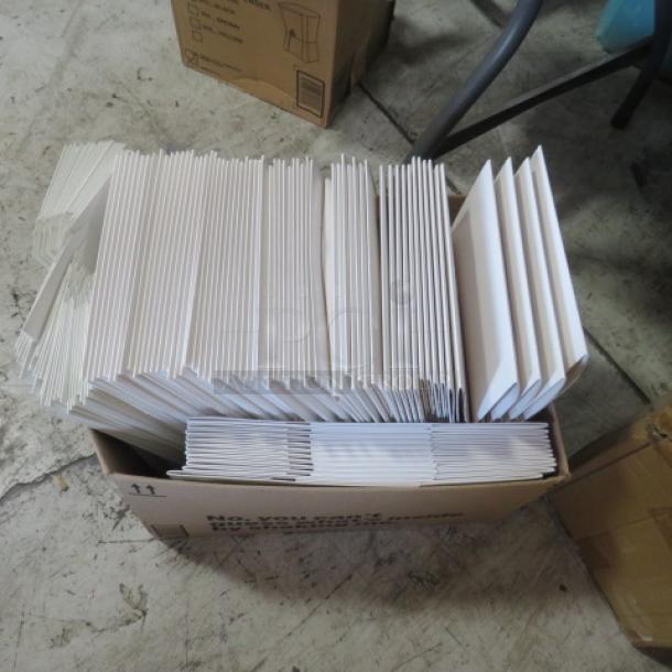 Alt text: A large box filled with assorted white pastry boxes in various sizes, stacked neatly. Boxes appear unused and in good condition.