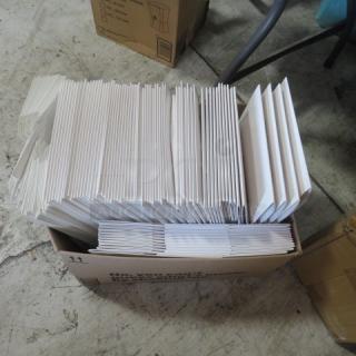 Alt text: A large box filled with assorted white pastry boxes in various sizes, stacked neatly. Boxes appear unused and in good condition.