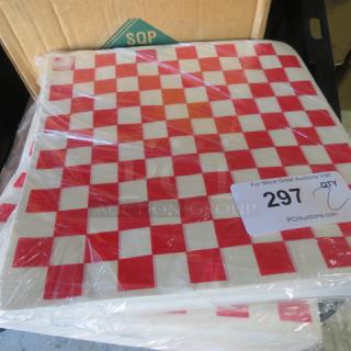12x12 case of red and white checkered deli papers, sealed in plastic, by SQP. Includes auction tag with number 297.