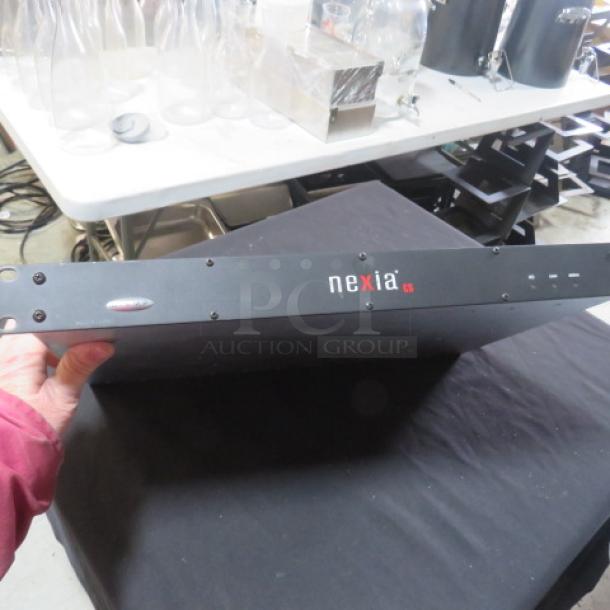 Nexia CS Biamp Digital Signal Processor, black casing, used condition, front panel with logo and status indicators visible.