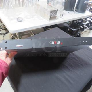 One Nexia CS Biamp Digital Signal Processor in good condition, black casing, with visible branding on the front panel.