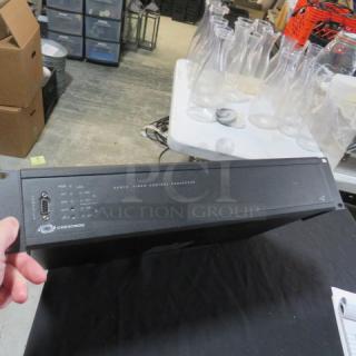Crestron AV2 Audio Video Control Processor, black, model #AV2, in used condition, showing front panel with ports and branding.