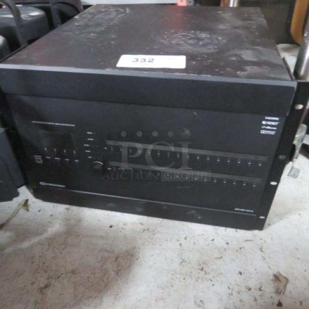 Crestron High Definition Digital Media Distribution unit in fair condition, model DM-MD16X16. Features multiple input/output ports.
