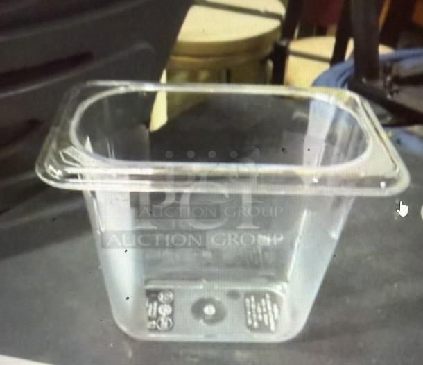 New Carlisle 6-inch deep food storage container, clear plastic, labeled with PCT Auction Group logo, model 6XBID.