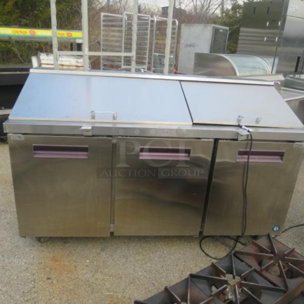 Hoshizaki 3-door refrigerated prep table with cutting board, model CRMR-72-30M, includes 2 racks, on casters, 72"x38"x45".