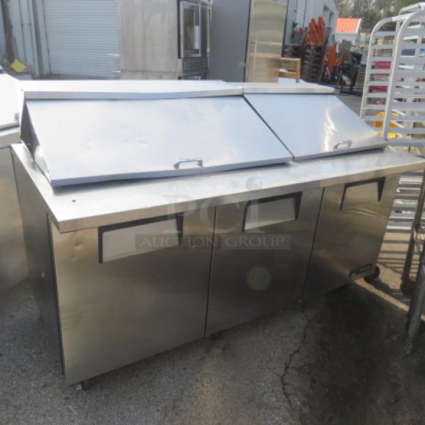 True 3-door refrigerated prep table on casters, 72"x34"x48", model TSSU-72-30M-B-ST, stainless steel, excellent condition.