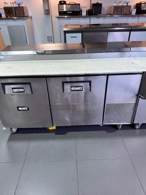 True TPP-67 commercial sandwich/pizza prep table with three labeled sections. Refined condition, fully tested.