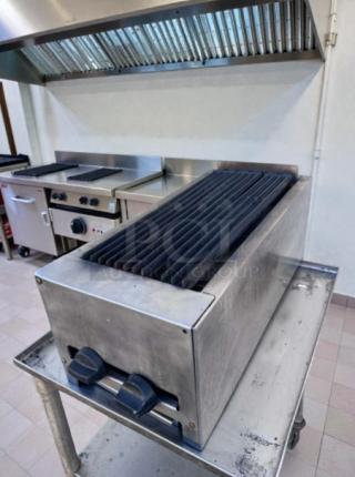 Commercial 24" gas charbroiler, stainless steel, lava rock grill, outstanding condition, fully tested and operational.