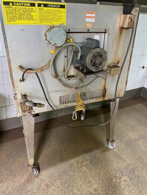 Rear view of Vulcan VC4GD-2 gas convection oven in excellent condition. Features solid state controls, 50,000 BTU, UL listed. Visible caution labels.