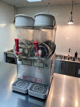 Ugolini/Cecilware dual slush dispenser, 2 bowls, 115V, NSF & UL listed, outstanding condition, fully tested, metallic finish.