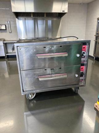 Stainless steel WITCO Commercial Double Drawer Warmer, NSF listed, fully tested, operational, on casters for mobility.